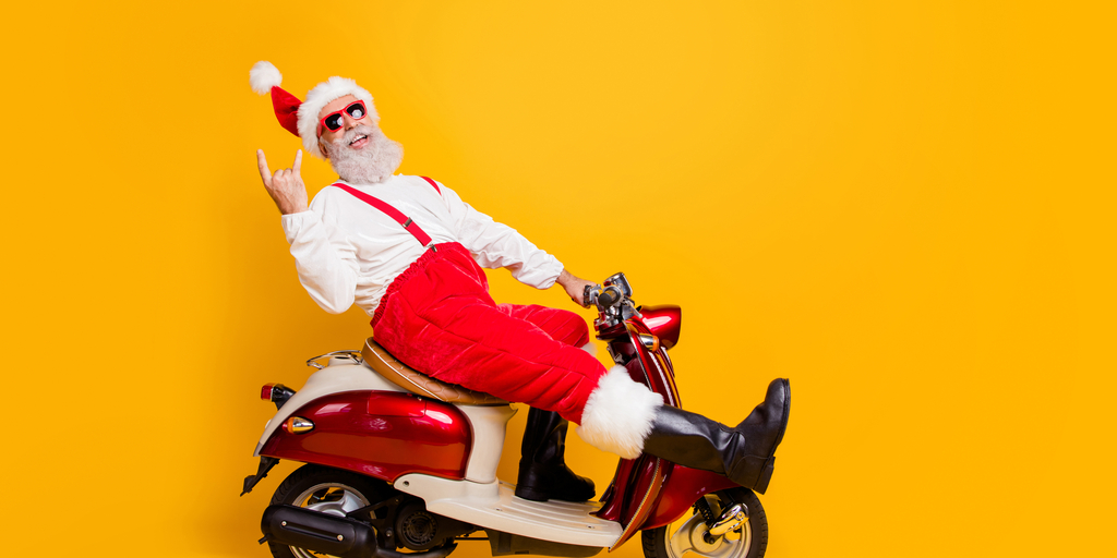 Santa kicking back on a moped