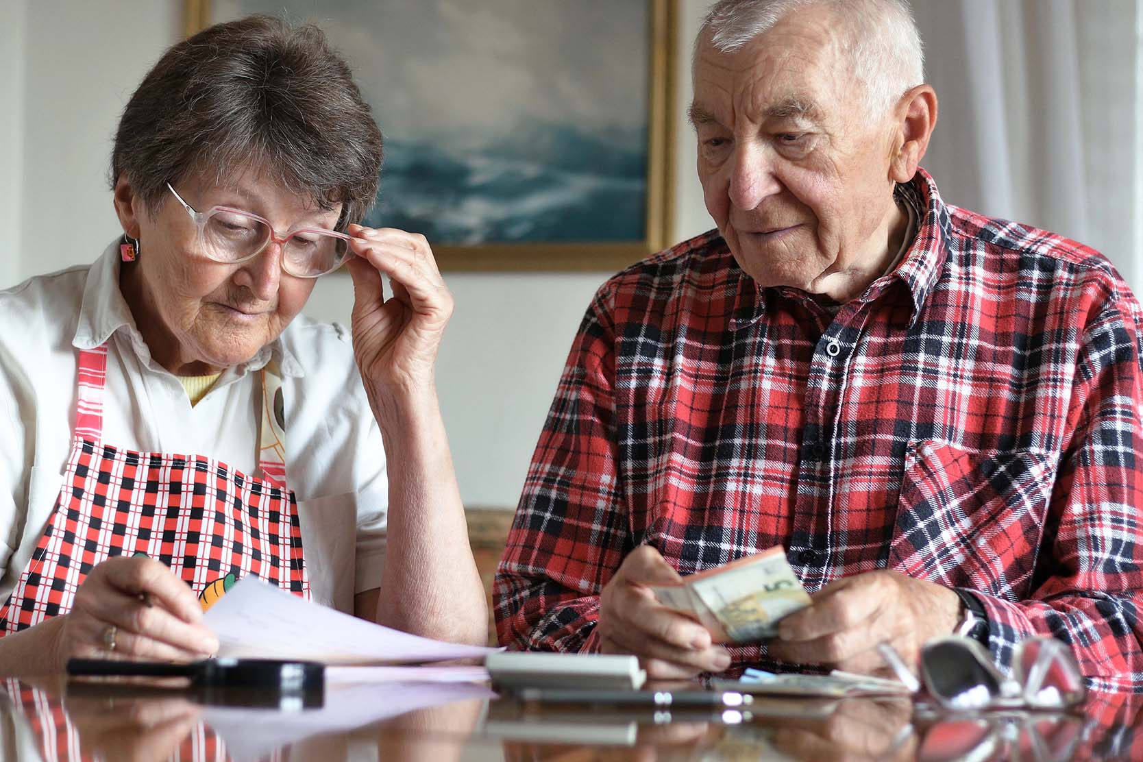 Senior couple looks over their finances